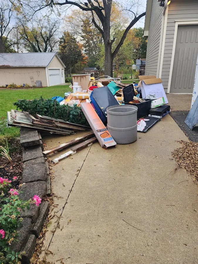 Dumpster being loaded with debris for 30 Yard Dumpster Rental in Fort Lee